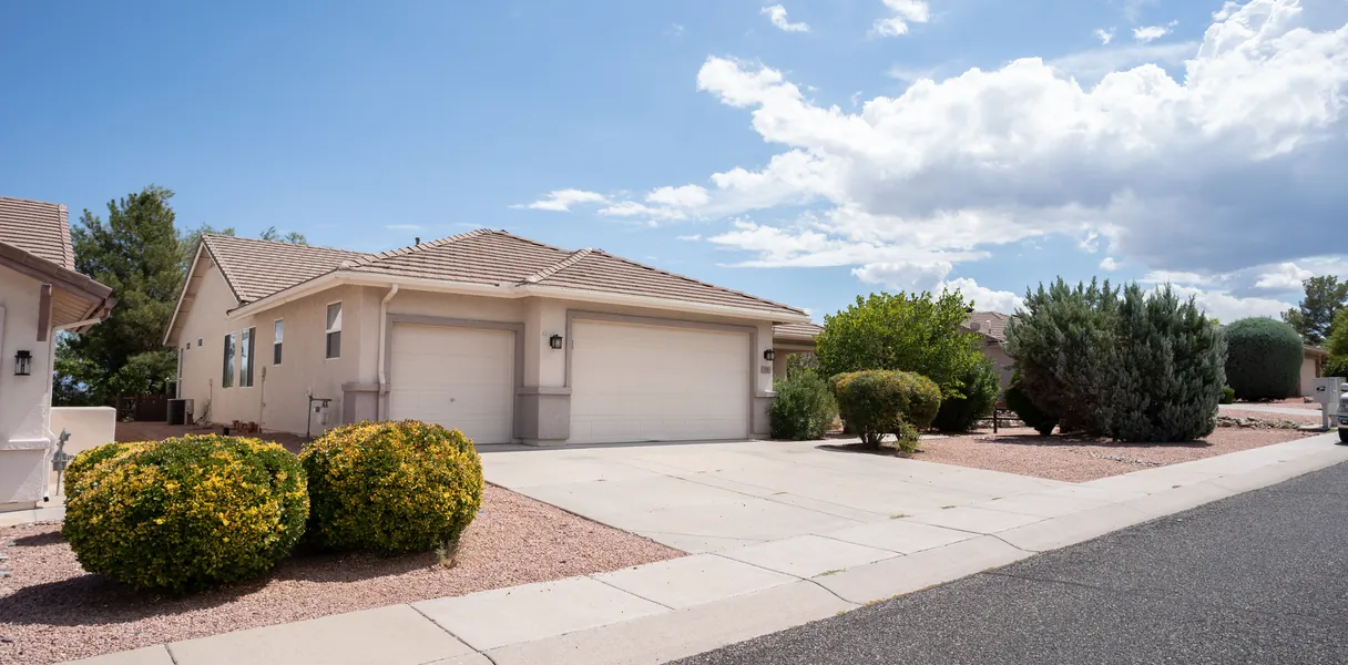 The front elevation and driveway of a single-storey suburban home.