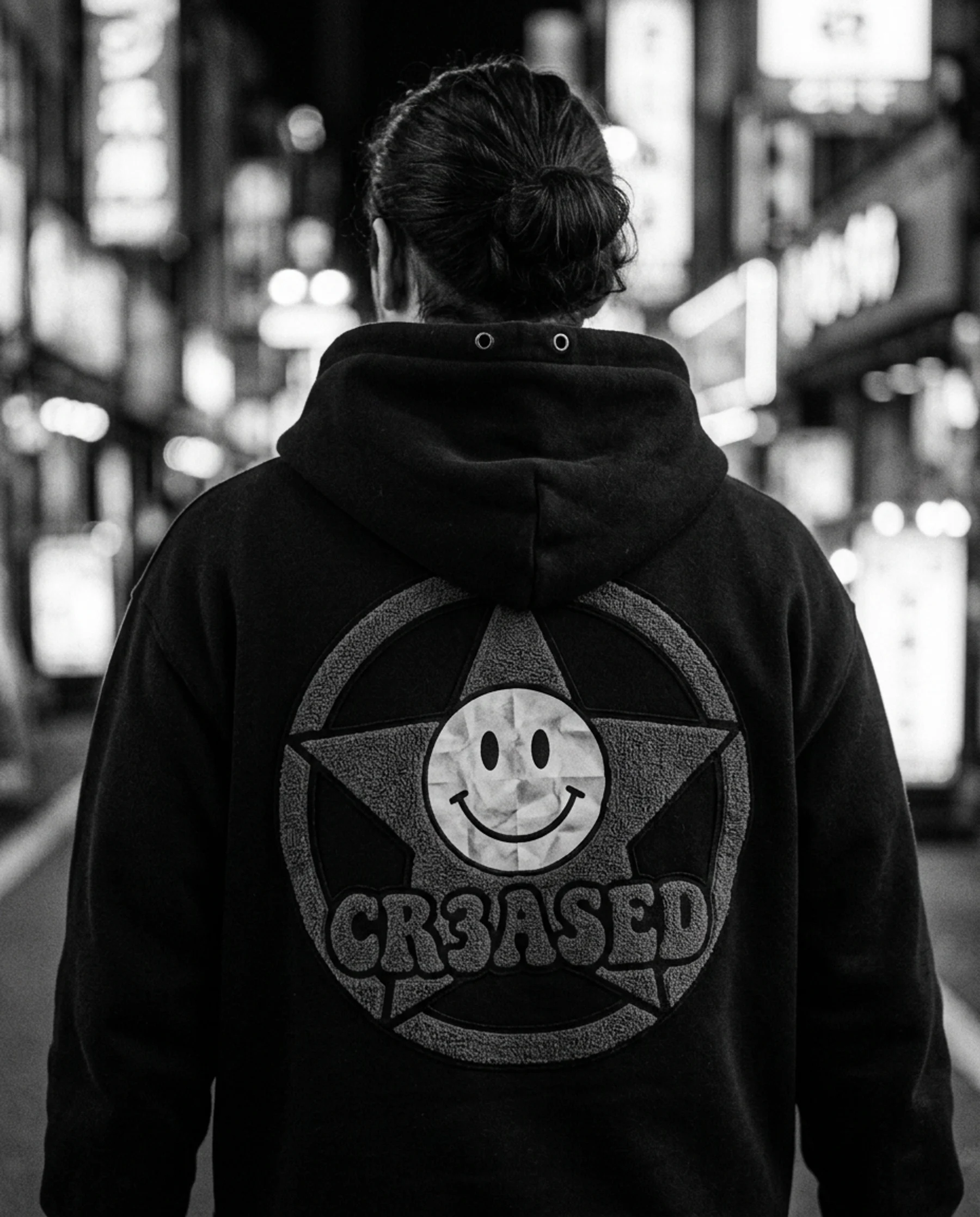 Close detail of the charcoal chenille star and Crumb on the back of the Ink hoodie